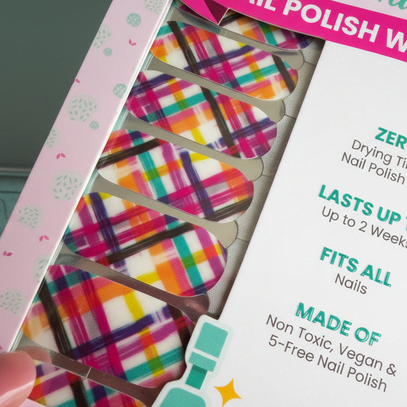 nail polish wraps with plaid colorful designs on a pink background