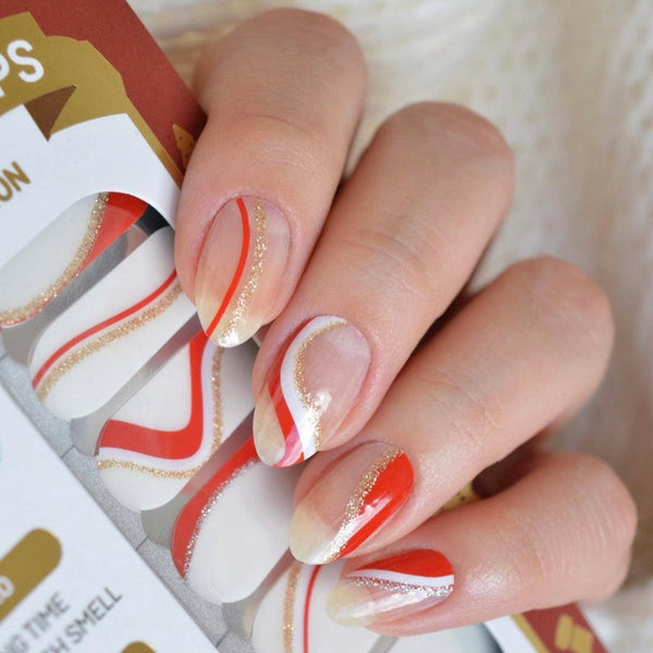 Candy Cane nail polish wraps, sheer nails with red and white candy cane swirls and gold glitter