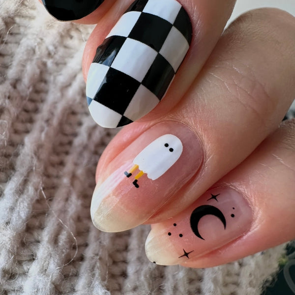 Casper black and white Halloween nail wraps on nails