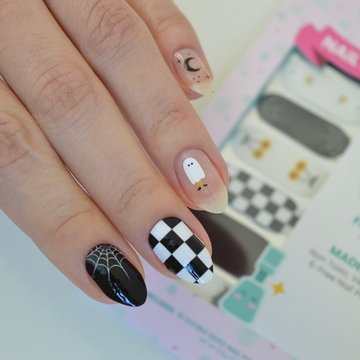 Casper black and white Halloween nail wraps on nails