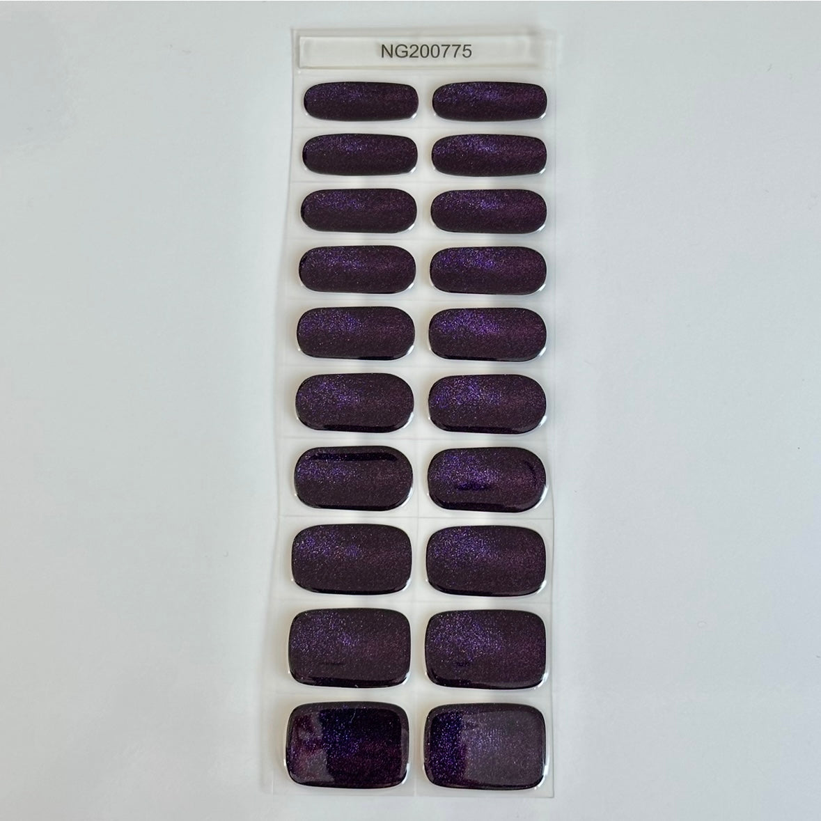 Sheet of Cat Eye Purple Super Jellies semi-cured gel nail wraps, deep purple cat-eye shimmer gel nails