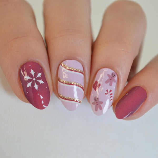 Christmas Eve nail wraps worn: snowflake, gold glitter ribbon and gingerbread nails