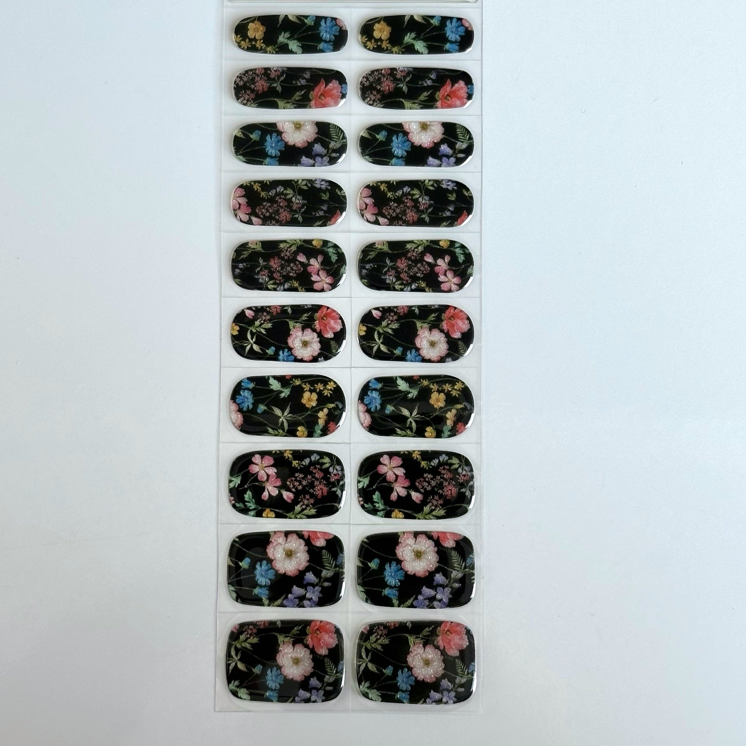 Sheet of floral nail art stickers on a white background
